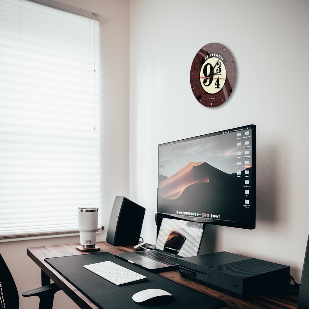 A desk with a computer and a monitorDescription automatically generated